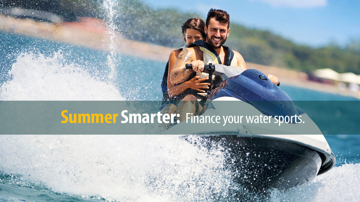 Couple enjoying riding a jet ski out on the open water.